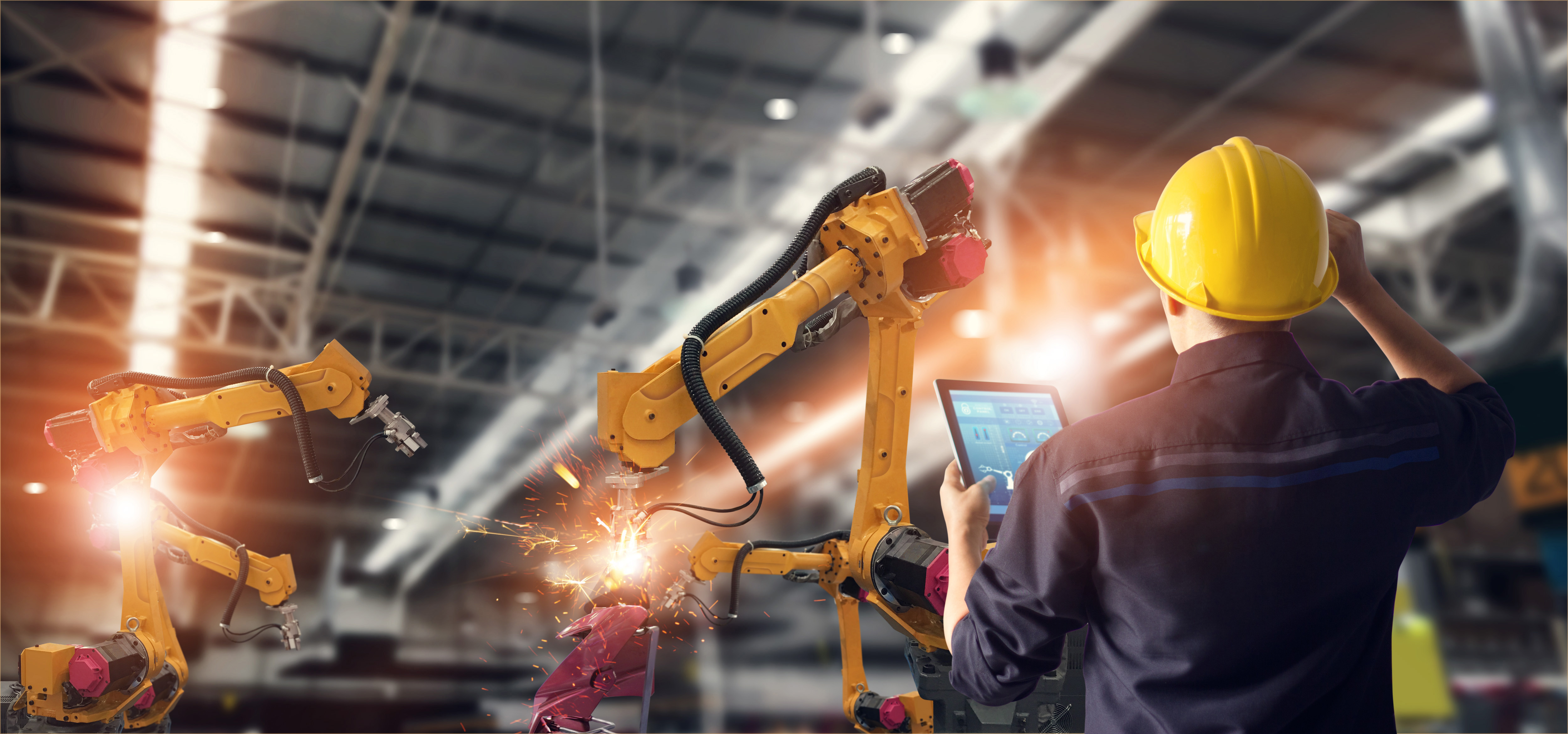 Factory worker holding tablet