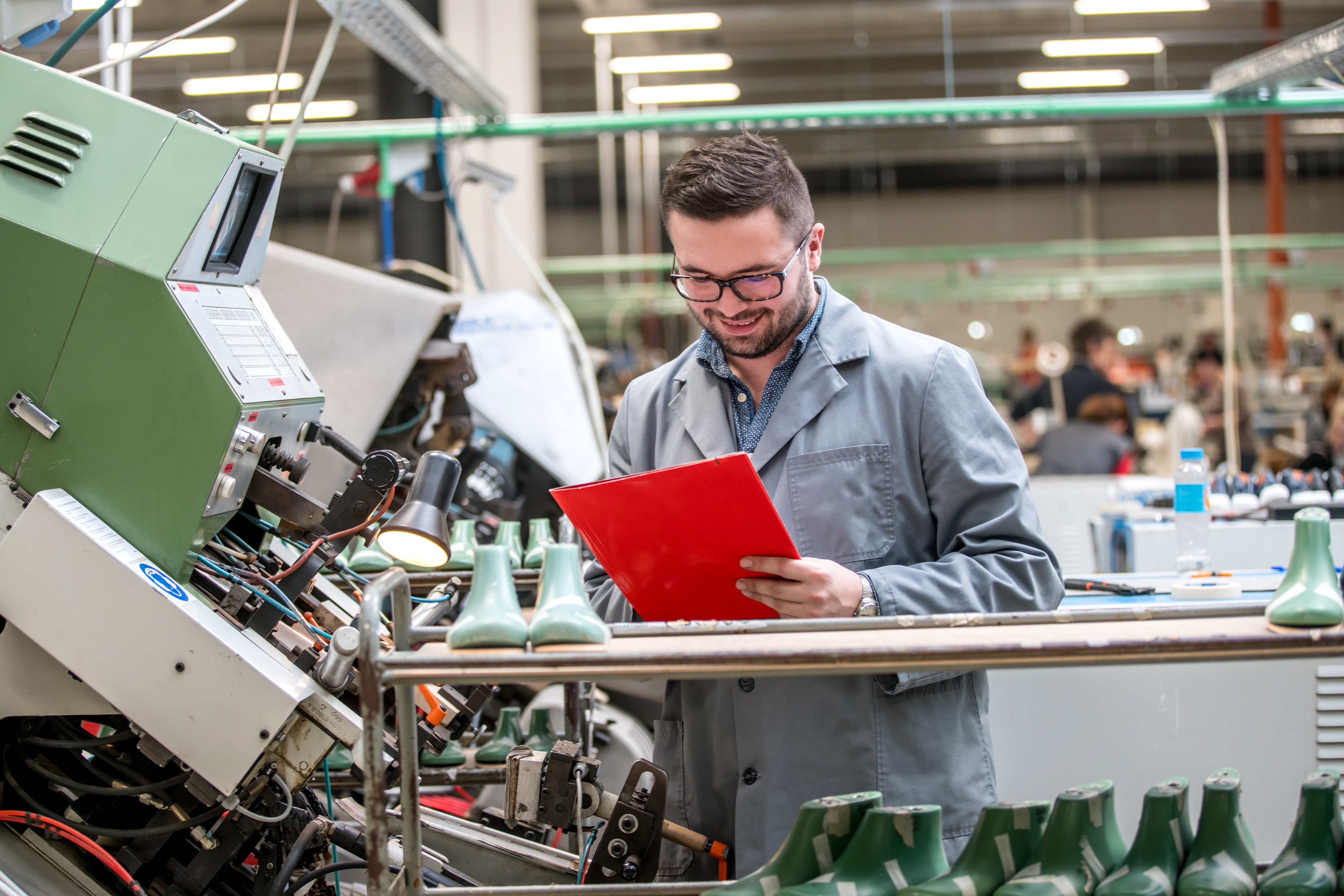 Man reviewing information on a tablet on the shop floor